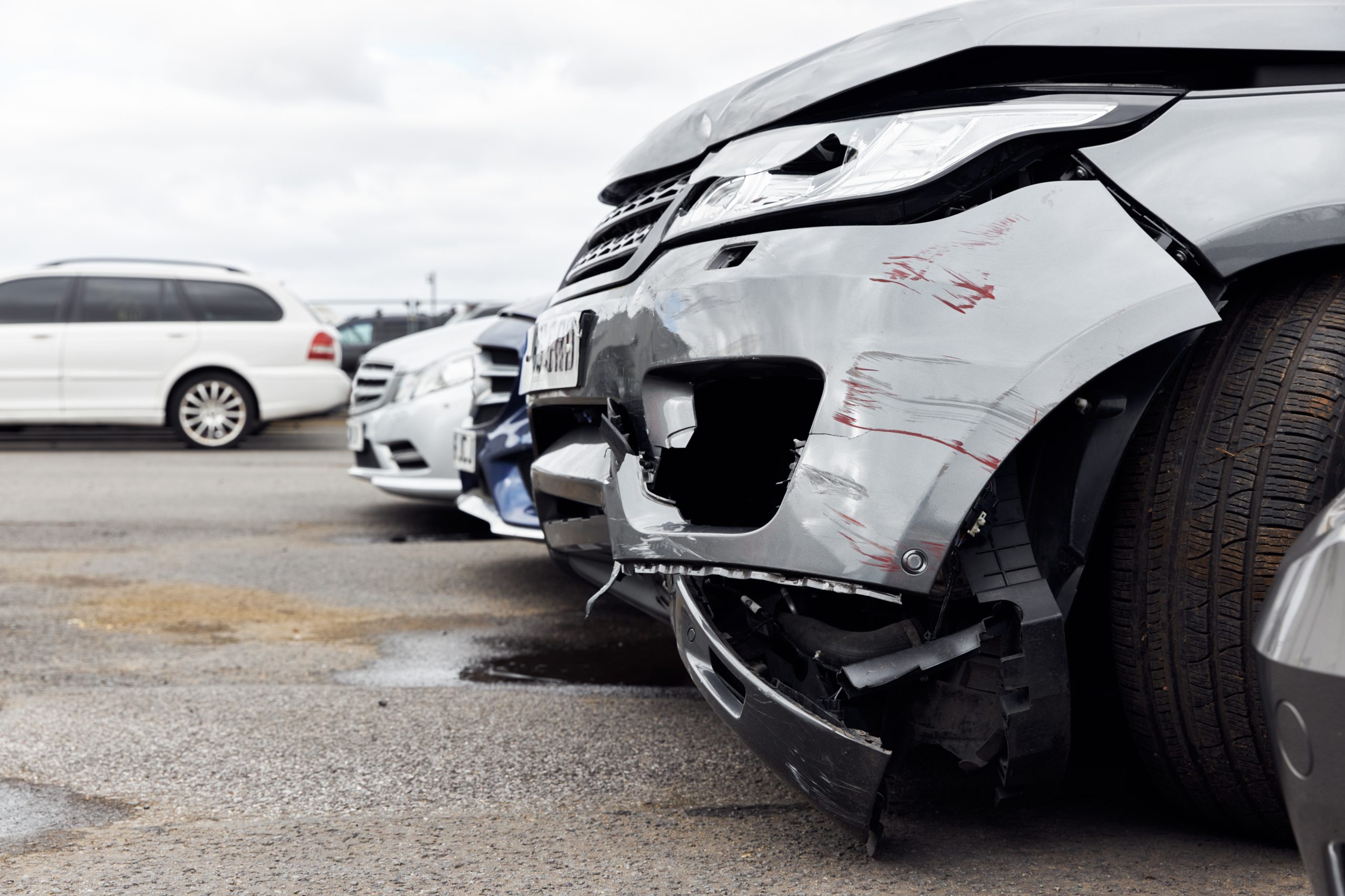 Damaged SUV after a motor vehicle accident, illustrating front-end collision damage that may result in whiplash and soft tissue injuries.